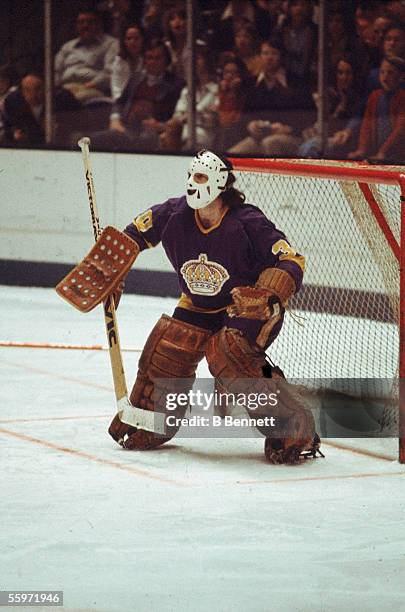 Canadian hockey player Rogatien Vachon, goalkeeper for the Los Angeles Kings, guards the net, 1970s.