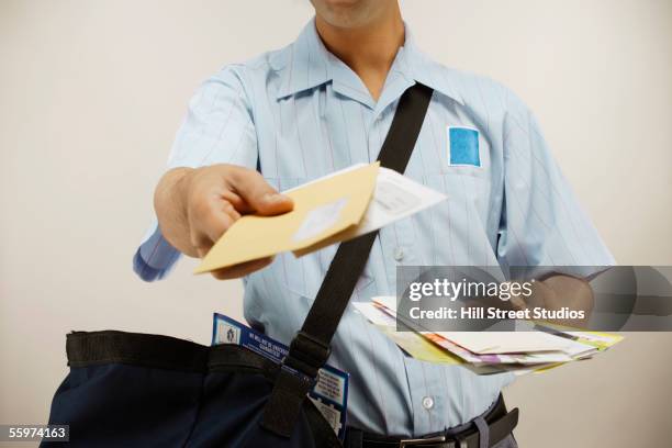 postman delivering mail - postbode stockfoto's en -beelden