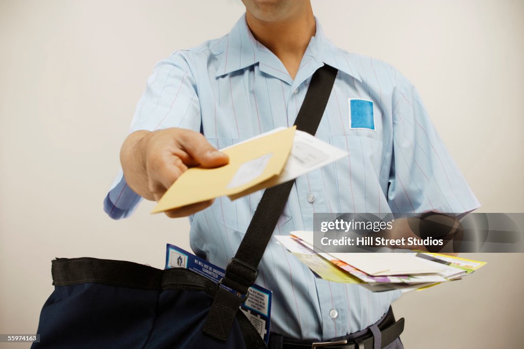 Postman delivering mail