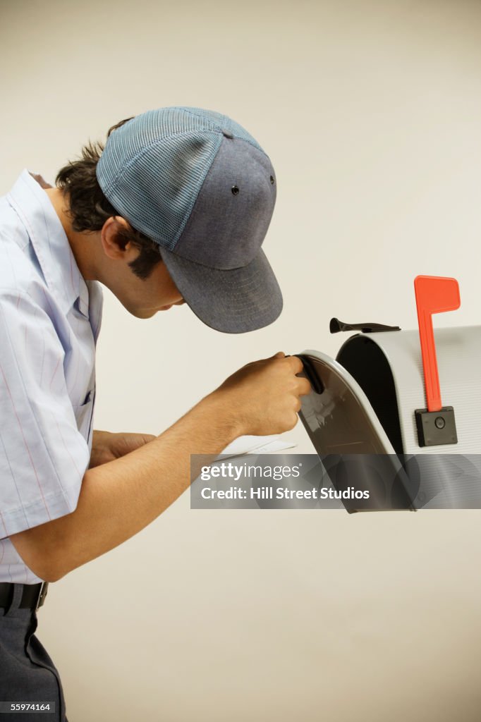 Postman opening mailbox