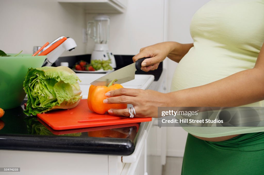 Pregnant woman preparing food