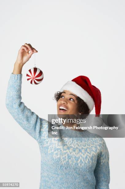 portrait of young woman - christmas hat stock pictures, royalty-free photos & images