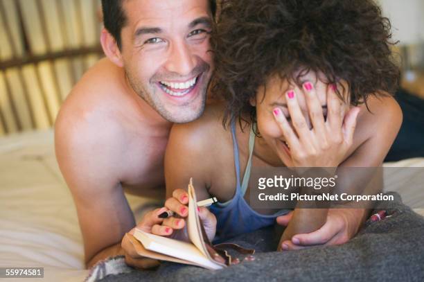 boyfriend peeking at womans diary - entrometido fotografías e imágenes de stock