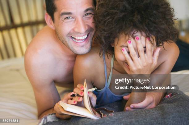 boyfriend peeking at womans diary - embarrassed girlfriend stock pictures, royalty-free photos & images