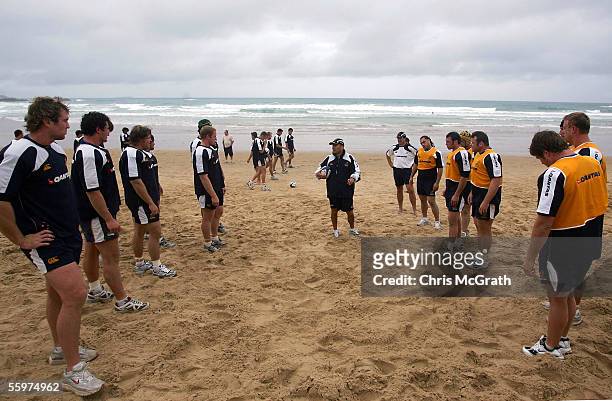 Wallabies coach Eddie Jones gives instructions to his players during the Wallabies beach training session on day three of the Wallabies Spring...