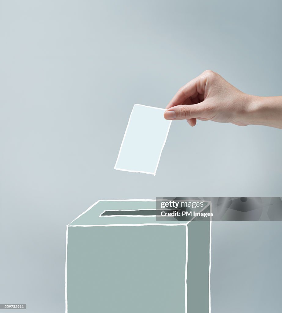 Hand placing ballot
