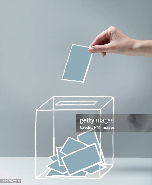 young woman's hand voting - démocratie photos et images de collection