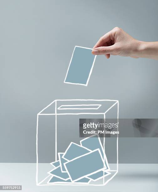 young woman's hand voting - democracy stock pictures, royalty-free photos & images