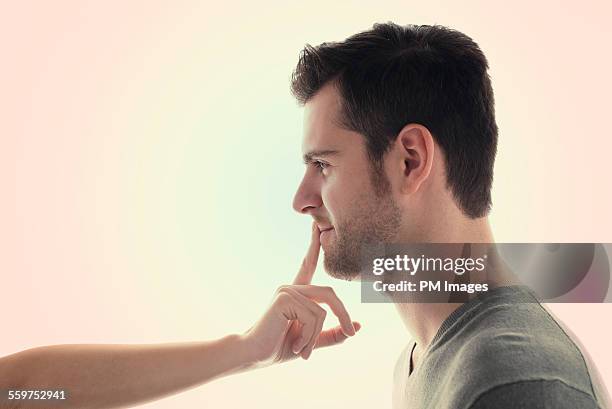 don't speak - woman with finger on lips stock pictures, royalty-free photos & images