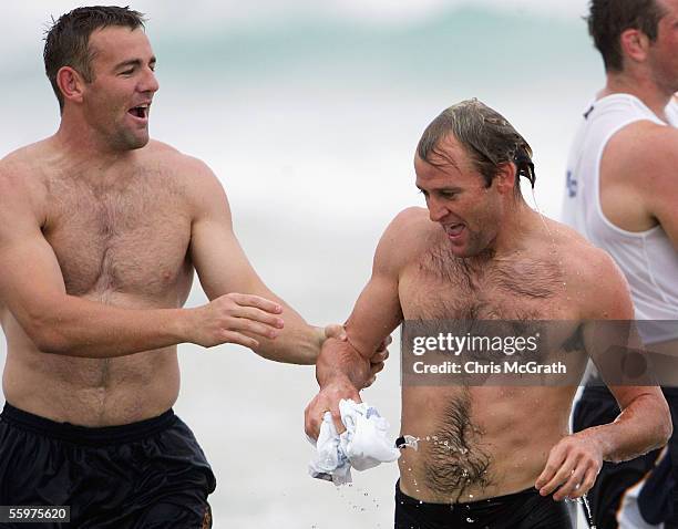 Chris Latham and Chris Whitaker joke around during the Wallabies beach training session on day three of the Wallabies Spring Training Camp held at...