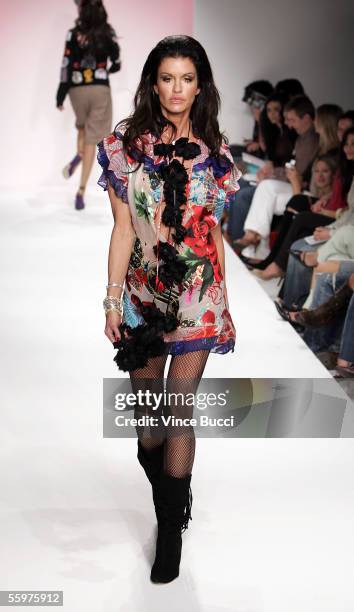 Model Janice Dickinson walks the runway at the Meghan Spring 2006 show during Mercedes-Benz Fashion Week at Smashbox Studios on October 20, 2005 in...