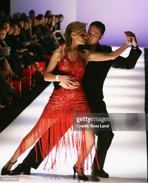 Former Miss Universe Lorraine Mexted dances the tango wearing Petrena Miller during day two of the Air New Zealand Fashion Week at the Viaduct...