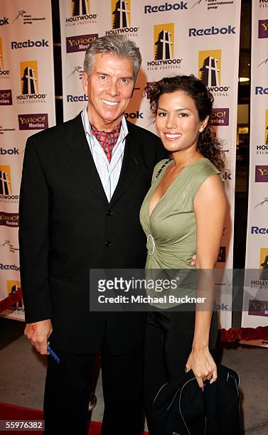 Sports personality Michael Buffer and Christine Prado arrive at the Hollywood Film Festival presentation of "Bullets Over Hollywood" at the Arclight...