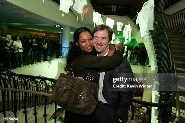 Actress Garcelle Beauvais and her husband Mike Nilon attend the LACOSTE and Barneys New York unveiling of celebrity customized polos, held at...