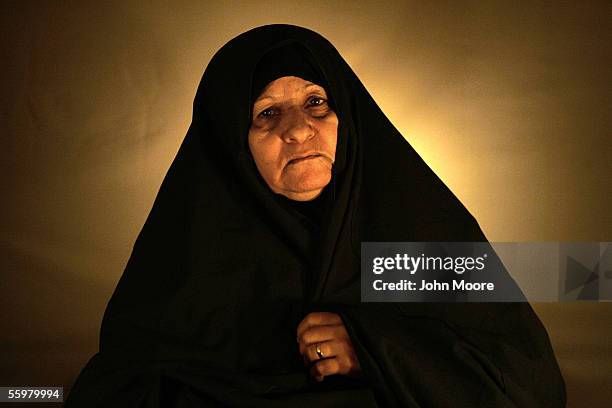 Dujail widow Majda Abed Al Jaleel poses for a photograph October 20, 2005 in Dujail, Iraq. Majda said that her husband, Hussain Hameed Mahdi, was a...