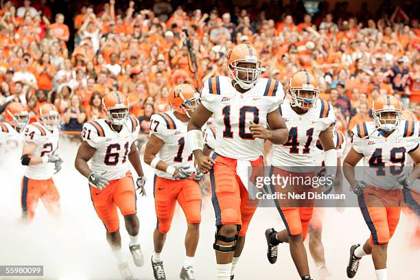 Quarterback Perry Patterson of the Syracuse University Orange leads the team out of the tunnel against the West Virginia University Mountaineers on...