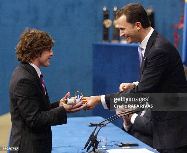 Spain's Prince Felipe de Borbon gives the Prince of Asturias award for Sports to Spanish driver and Formula 1 World Champion Fernando Alonso, 21...