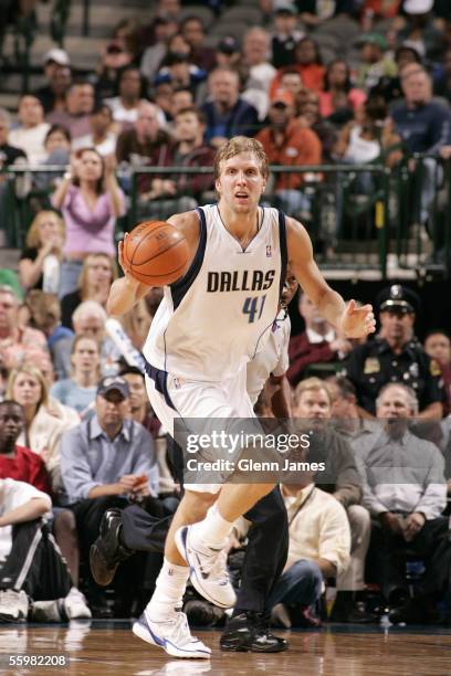 Dirk Nowitzki of the Dallas Mavericks handles the ball up the court against the New York Knicks on October 21, 2005 at American Airlines Center in...