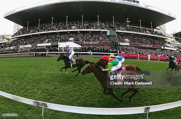 Glen Boss celebrates on Makybe Diva as he wins the 2005 Cox Plate during the 2005 Cox Plate Race Day at Moonee Valley Racecourse October 22, 2005 in...