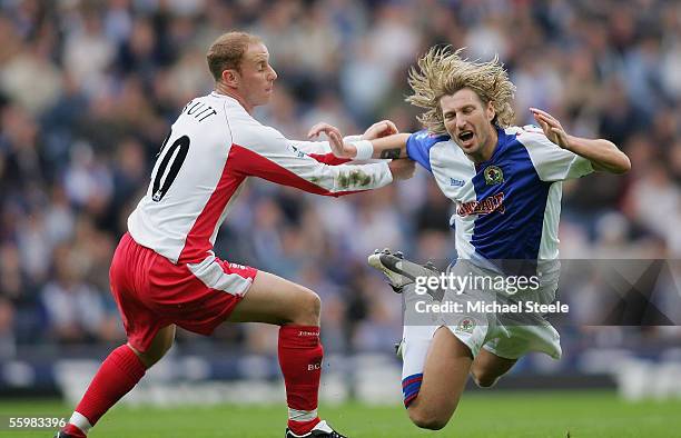 Robbie Savage of Blackburn is fouled by Nicky Butt during the Barclays Premiership match between Blackburn Rovers and Birmingham City at Ewood Park...