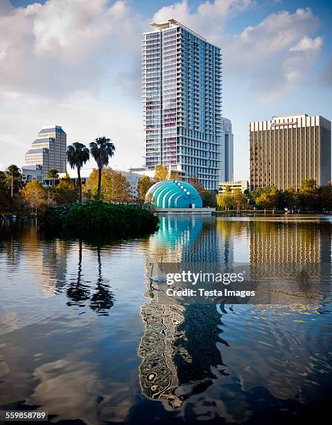 lake eola reflections - orlando florida lake eola stock pictures, royalty-free photos & images