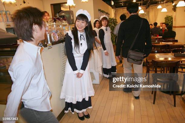 Women in costume give welcome customers at a Maid Hair Salon in the Akihabara District October 22, 2005 in Tokyo, Japan. The Akihabara District is...