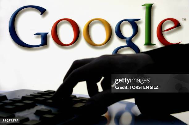 Germany: A woman works on her computer as on the wall behind is seen the logo of web search engine Google at Frankfurt's international book fair, on...