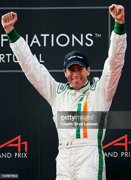 Ralph Firman of Ireland celebrates taking 3rd place in the A1 Grand Prix of Nations Feature race at the Circuito Estoril on October 23, 2005 in...