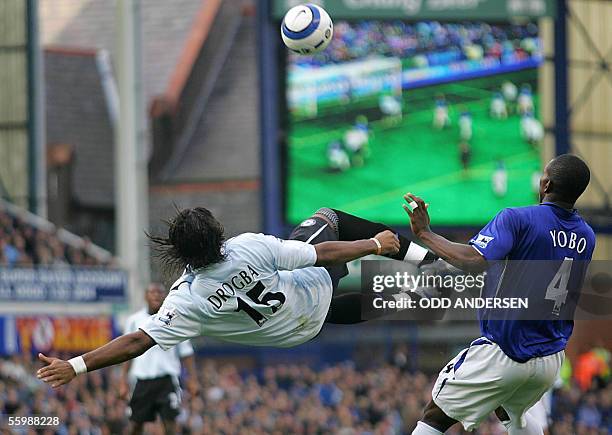 Liverpool, UNITED KINGDOM: Didier Drogba of Chelsea attempts a bicycle kick watched by Joseph Yobo of Everton during a premiership match at Goodison...