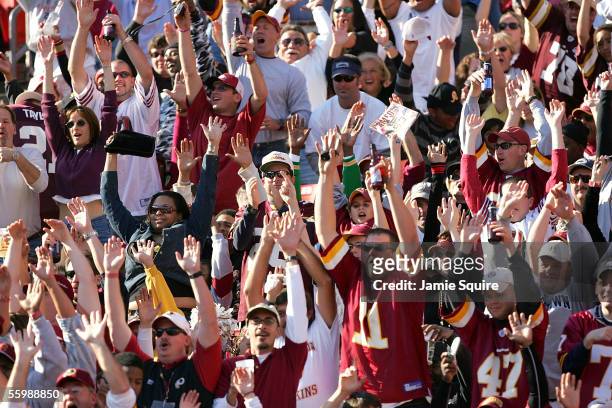 Washington Redskins fans cheer during the second half of the game against the San Francisco 49ers on October 23, 2005 at Fed Ex Field in Landover,...