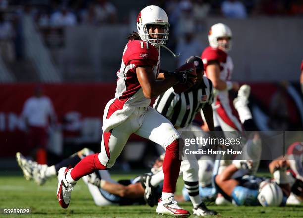 Wide receiver Larry Fitzgerald of the Arizona Cardinals runs after his catch against the Tennessee Titans during the third quarter at Sun Devil...