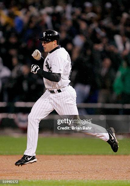 Scott Podsednik of the Chicago White Sox celebrates while he runs around the bases after hitting the game-winning home run against the Houston Astros...