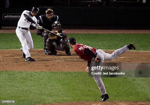 Scott Podsednik of the Chicago White Sox hits the game-winning home run in the ninth inning off pitcher Brad Lidge of the Houston Astros to win Game...