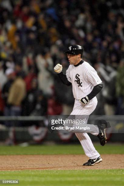 Scott Podsednik of the Chicago White Sox rounds the bases after hitting a game winning home run off of Brad Lidge during the bottom of the ninth...