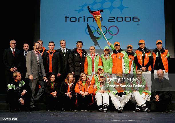 Willy Bogner and the athletes pose for a photo during the Presentation of the official Turin 2006 wardrobe to the German Winter Olympics Team on...