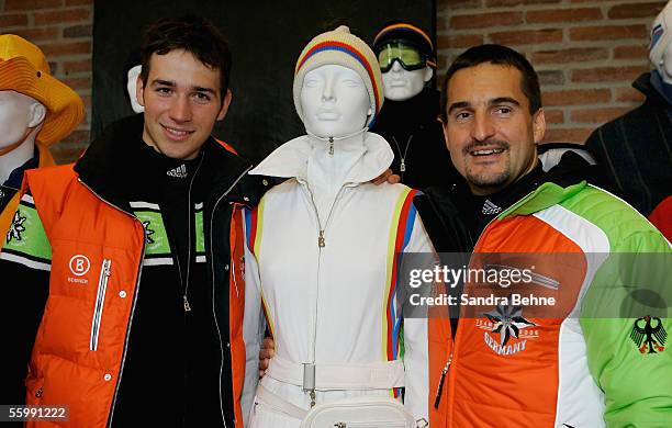 Felix Neureuther and Georg Hackl pose for a photo during the Presentation of the official Turin 2006 wardrobe to the German Winter Olympics Team on...