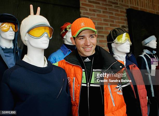 Felix Neureuther jokes while posing for a photo during the Presentation of the official Turin 2006 wardrobe to the German Winter Olympics Team on...