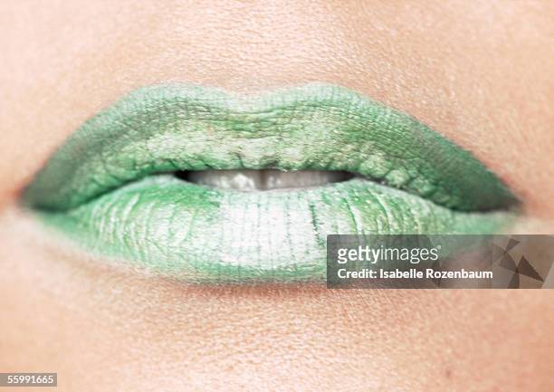 woman wearing green lipstick, close up of mouth. - extreme close up mouth stock pictures, royalty-free photos & images