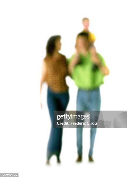 silhouette of woman and man with child on shoulders, on white background, defocused - couple walk white background stock pictures, royalty-free photos & images