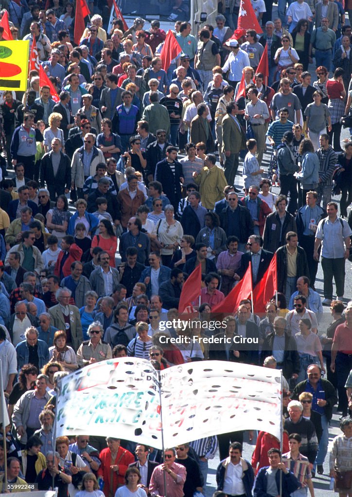 Crowd of  people in parade.