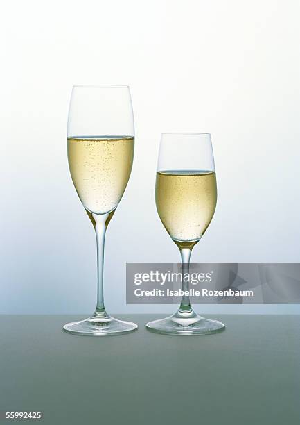 two flutes of champagne - champagne flute empty stock-fotos und bilder