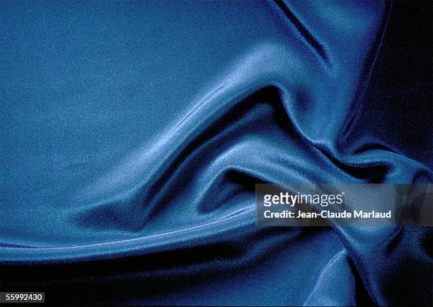 folds in silky blue fabric, close-up, full frame - satin imagens e fotografias de stock