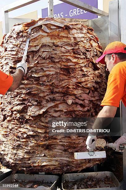 Costas Dasios , a restaurant owner in the western Greek port of Patras makes the world's largest kebab with the help of his employees for the...