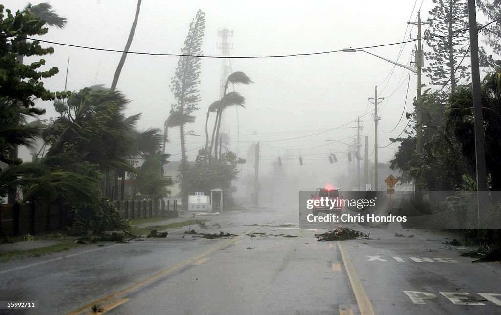 A van drives down a boulevard during Hurricane Wilma October 24, 2005 ...