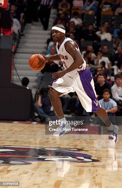 Mike James of the Toronto Raptors drives during a exhibition game against the Maccabi Tel-Aviv at the Air Canada Centre on October 16, 2005 in...