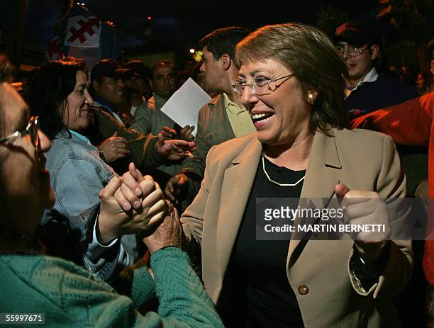 Chilean candidate for presidential elections Michelle Bachelet, of the Socialist Party, greets supporters 20 October, 2005 during a political rally...