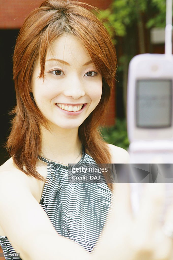 Two Young Adult Women Taking Photos