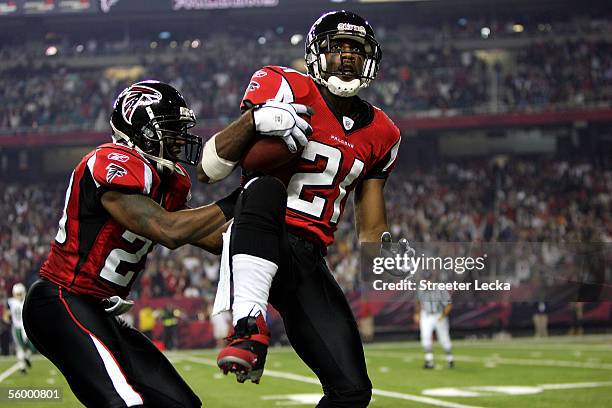 Teammates Keion Carpenter and DeAngelo Hall of the Atlanta Falcons celebrate after Hall made an interception in the second half of their game against...