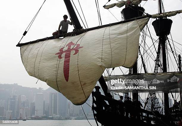 The replica of the Spanish Ship "Nao Victoria", the first Spanish ship to circumnavigate the globe, unfurles its sail in Victoria Harbour, Hong Kong,...