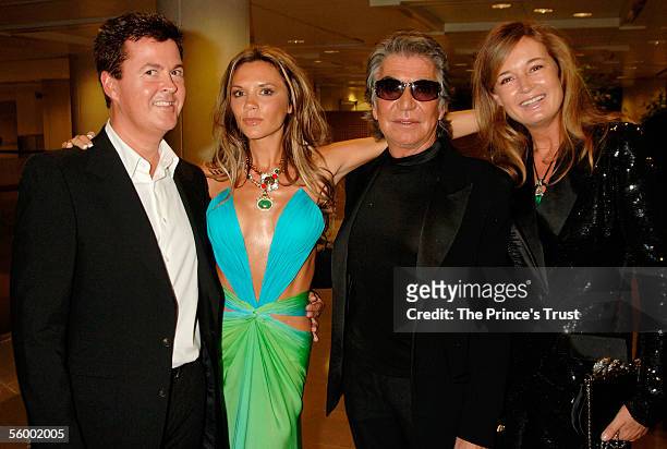 Simon Fuller, Victoria Beckham, Roberto Cavalli and his wife Eva attends the champagne reception at the Swarovski Fashion Rocks for The Prince's...